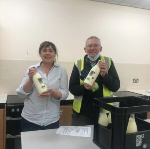 Ruth from TMBSS having milk delivered from the Proper Good Dairy by Derek our volunteer | Shrewsbury Food Hub