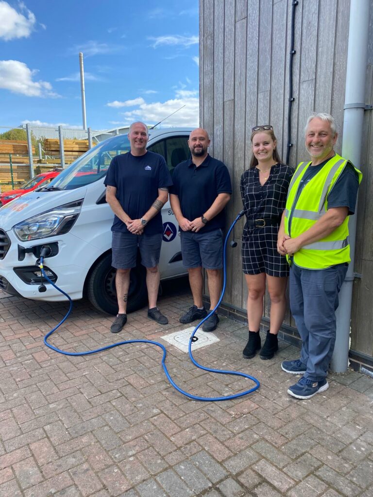 Tom, Dan, John and Emily with EV-Charger
